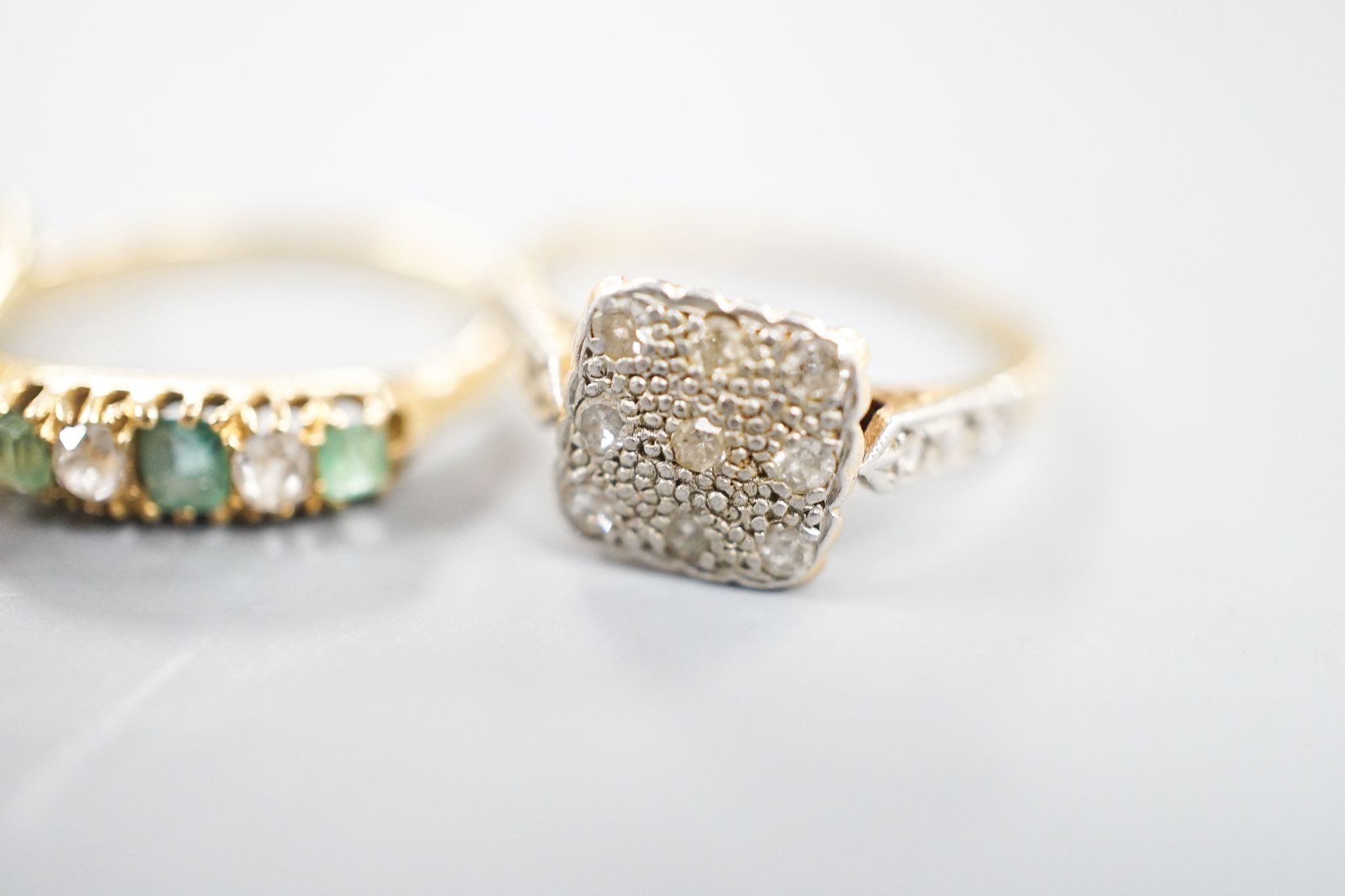 Two 18ct, plat. and diamond chip set dress rings and an 18ct, emerald and diamond set five stone ring, sizes P,I and H/I, gross weight 6 grams.